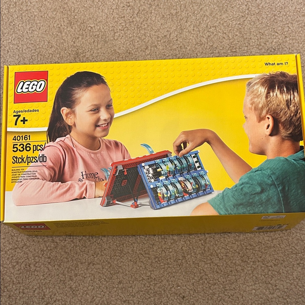 Lego Yellow Box with Red, Blue, Green and White Building Pieces